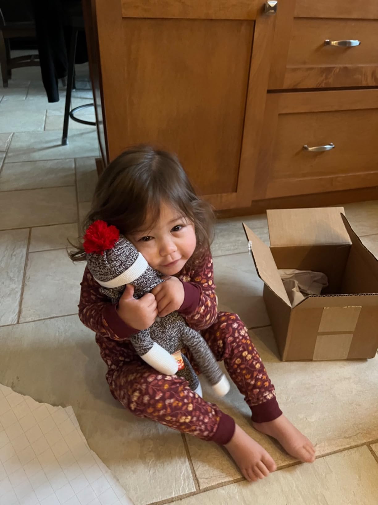 Customer photo of a sock monkey plush stuffed animal