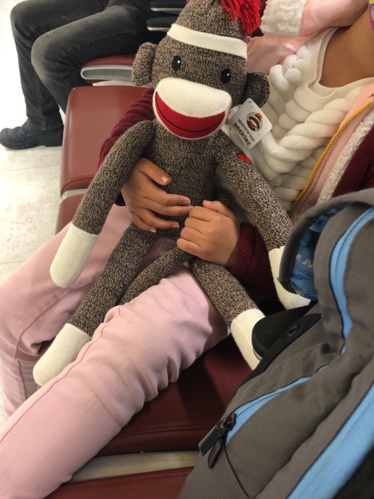 Customer photo of a sock monkey plush toy